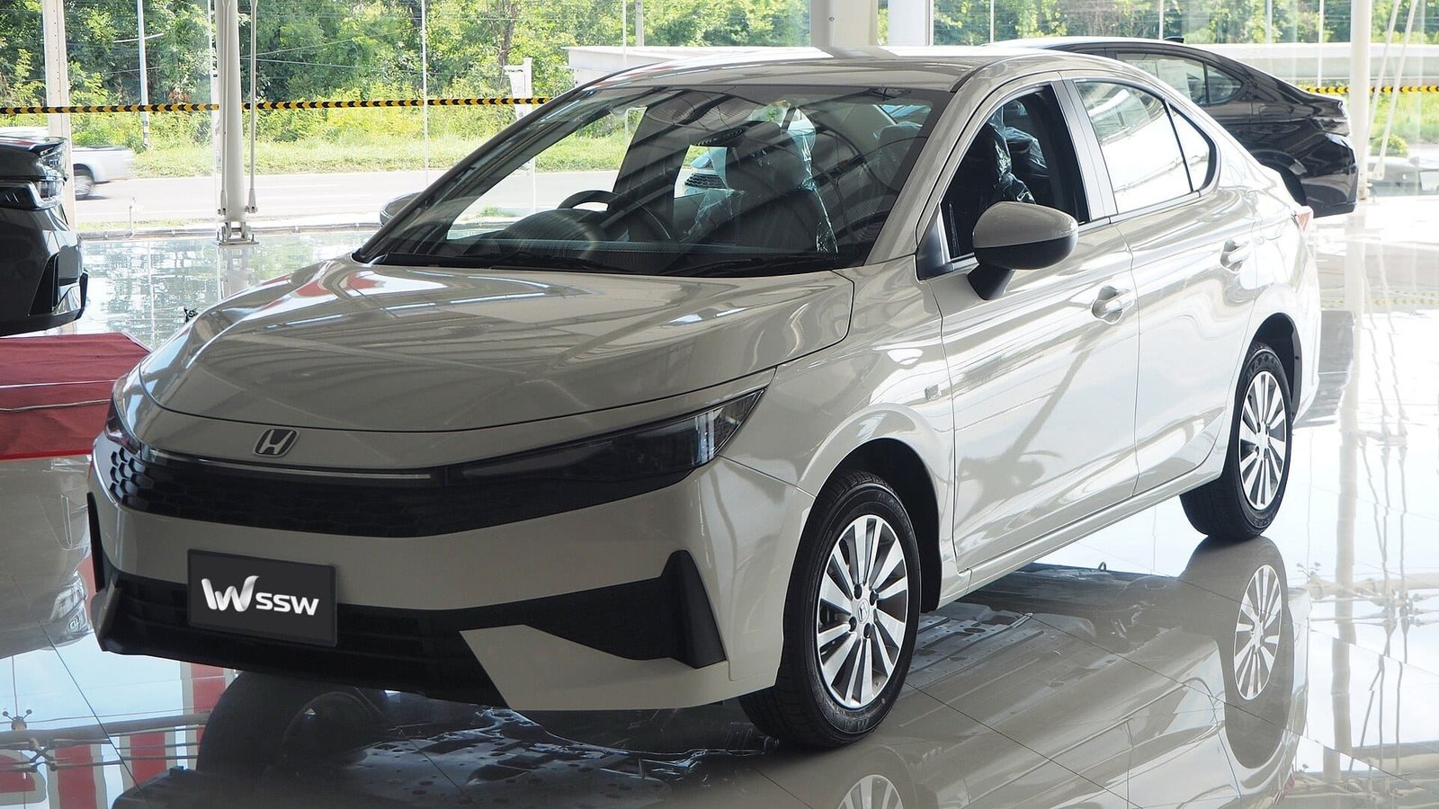 2026 Honda City S sedan in white, front three-quarter view in a bright dealership showroom in Khon Kaen, Thailand